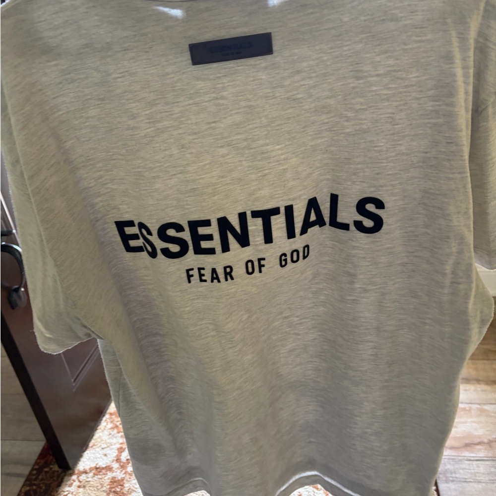 Fear of God Essentials Light Gray Tee with Black Lettering
